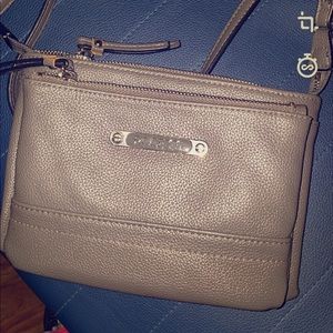 A crossover gray small purse